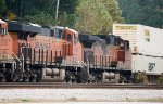 BNSF 6648 and 5393 run third and fourth in a quartet of units